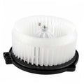 White plastic AC heater blower motor fan with metal shaft, mounted on black base