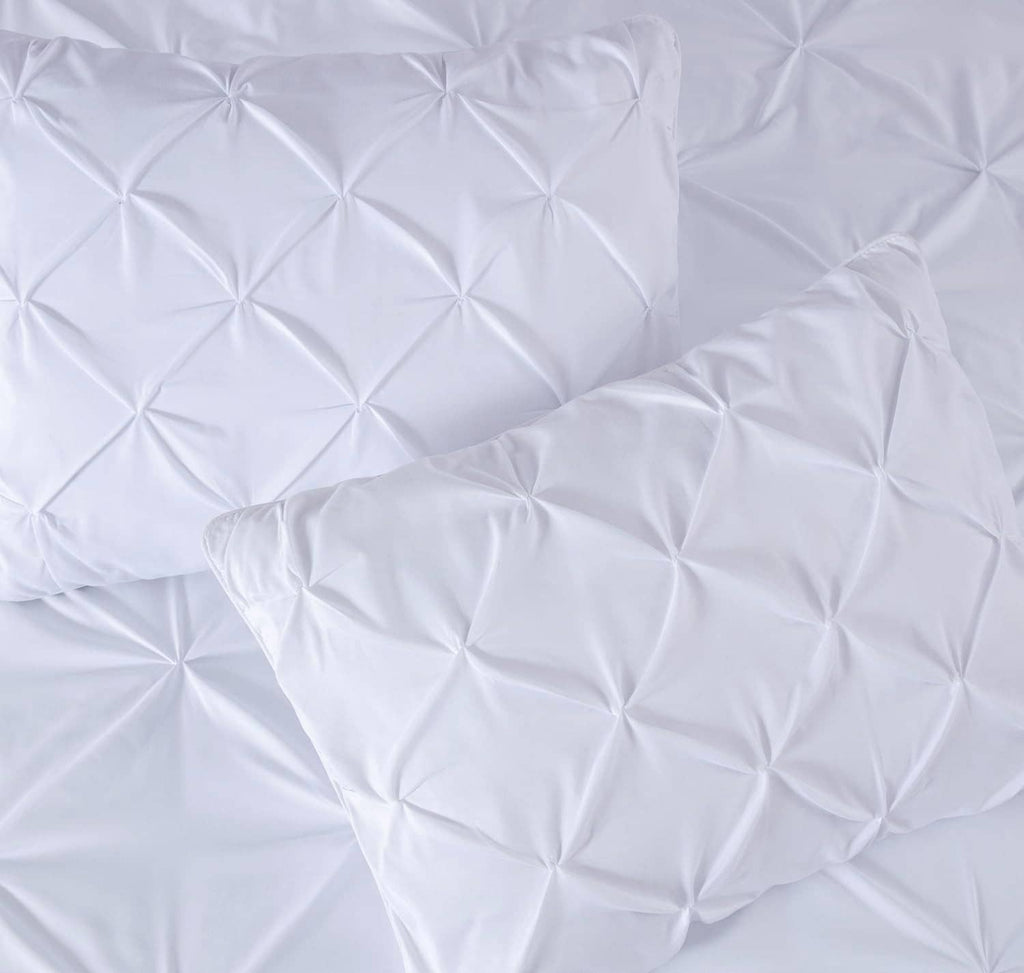 White pillow sham pair with quilted diamond pinch pleat texture