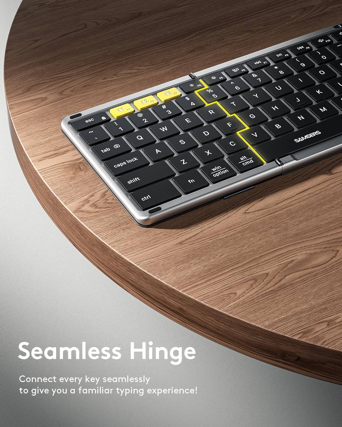 Foldable keyboard close-up with seamless hinge and blue backlit keys