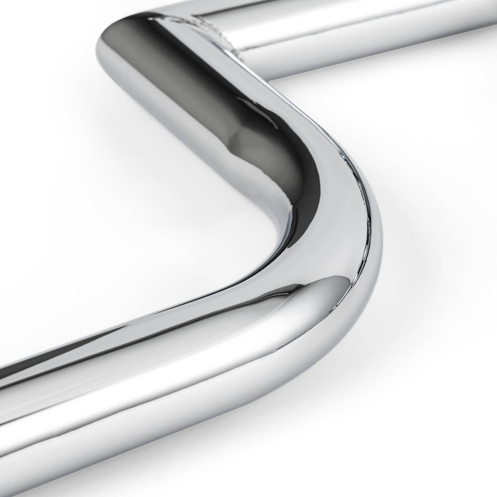 Chrome engine guard crash bar tubular curve, close-up