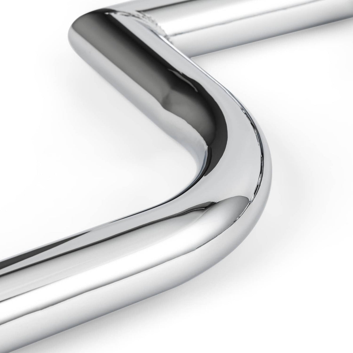 Chrome engine guard crash bar tubular curve, close-up