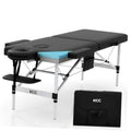 Portable foldable massage table with black armrests and blue headrest pad, aluminum legs