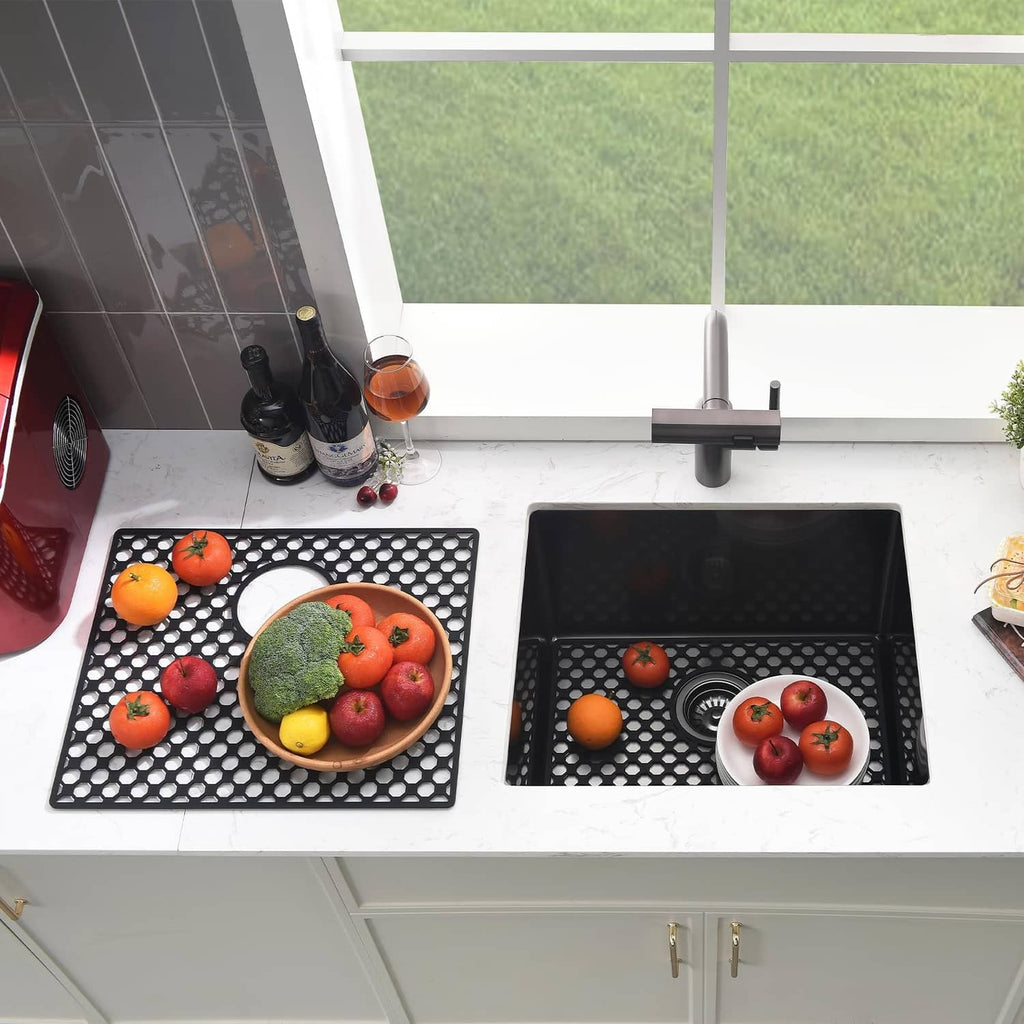 Two black silicone sink mats with drain openings and hexagonal hole pattern