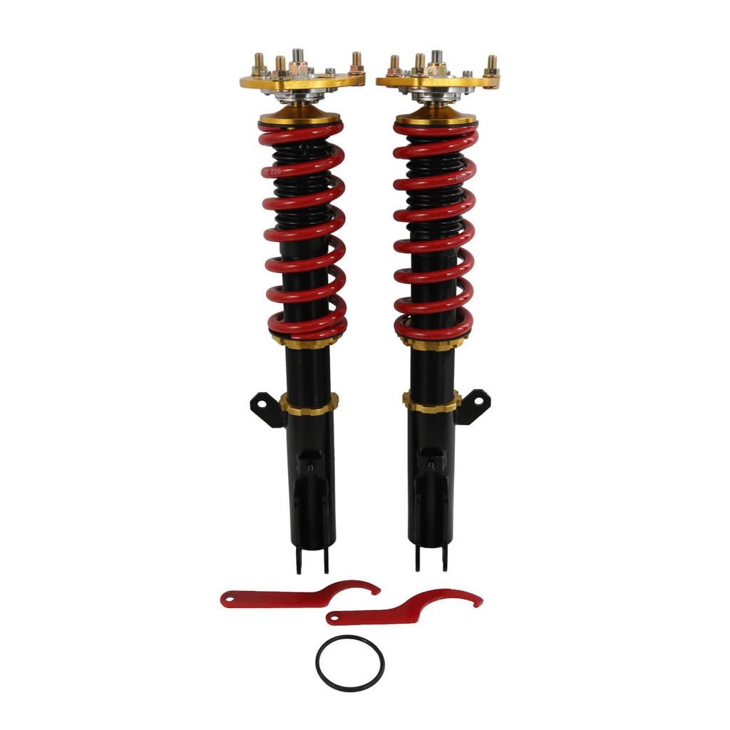Pair of coilover struts with red springs, black dampers, and gold upper spring seats