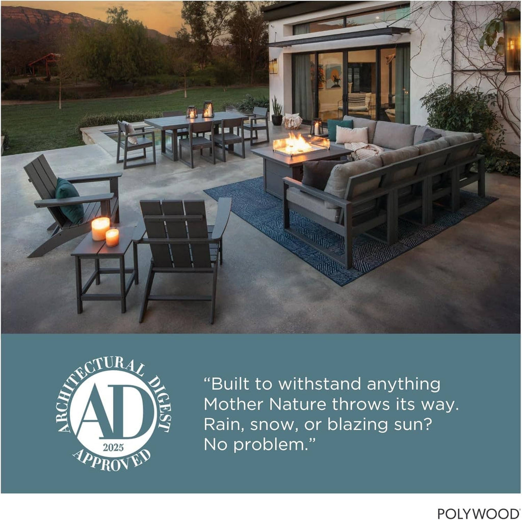 Dark gray Adirondack chairs on patio near a small outdoor firepit
