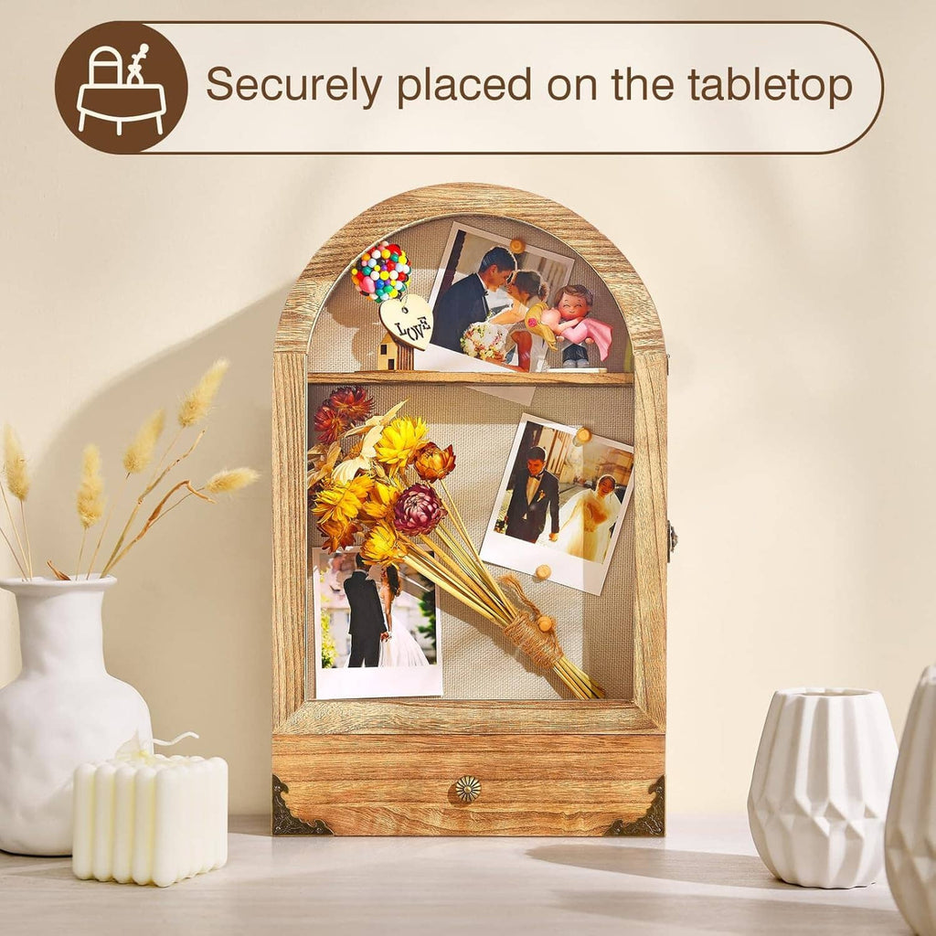 Large arched shadow box display case with linen back and photo cards, shown on tabletop