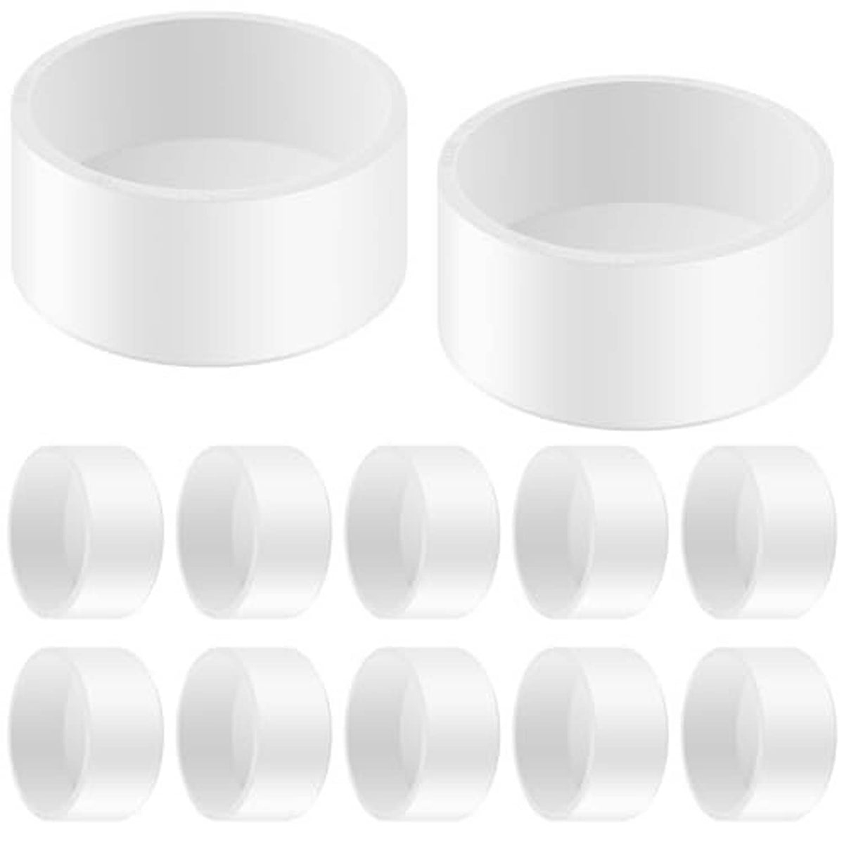 Set of white PVC pipe end caps with open round interiors and smooth sides