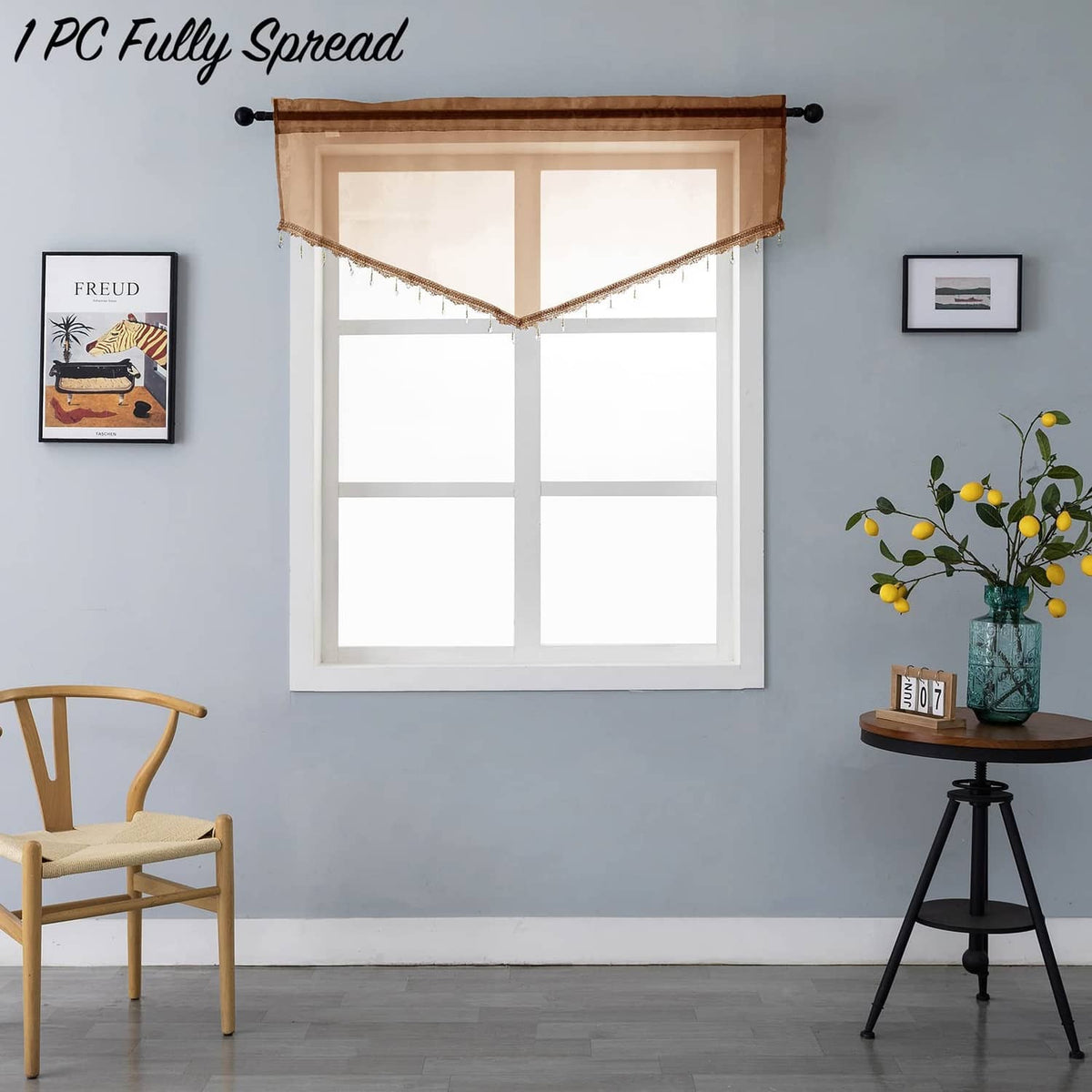 Brown sheer valance curtain spread out with bead-trim fringe along the bottom