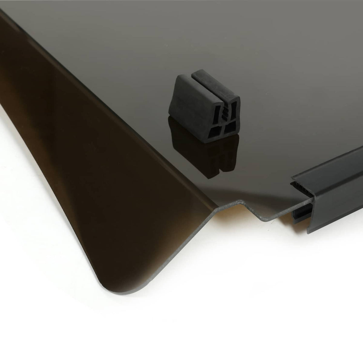 Tinted windscreen corner joint with black bracket hardware