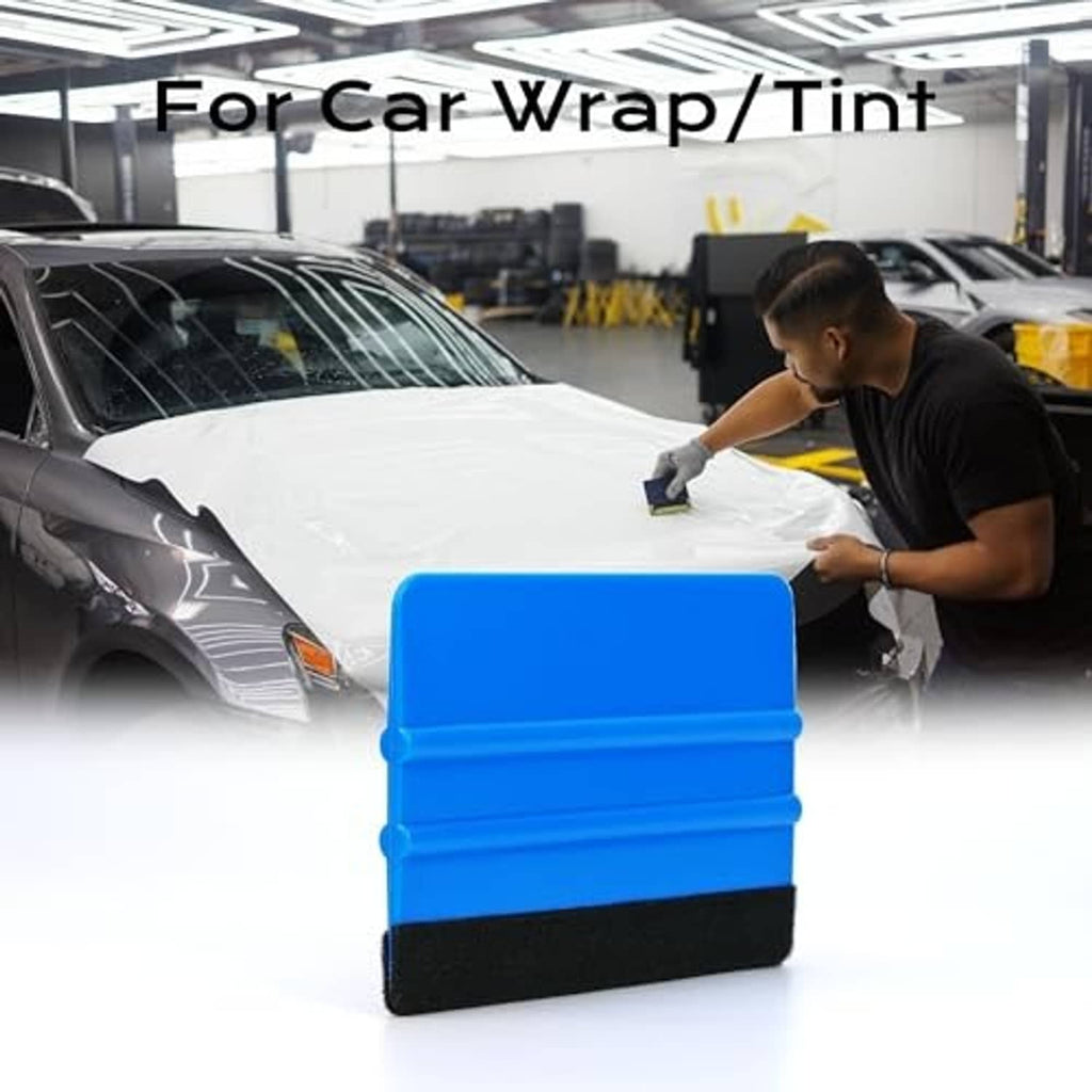 Blue felt-edge vinyl wrap scraper on a car surface