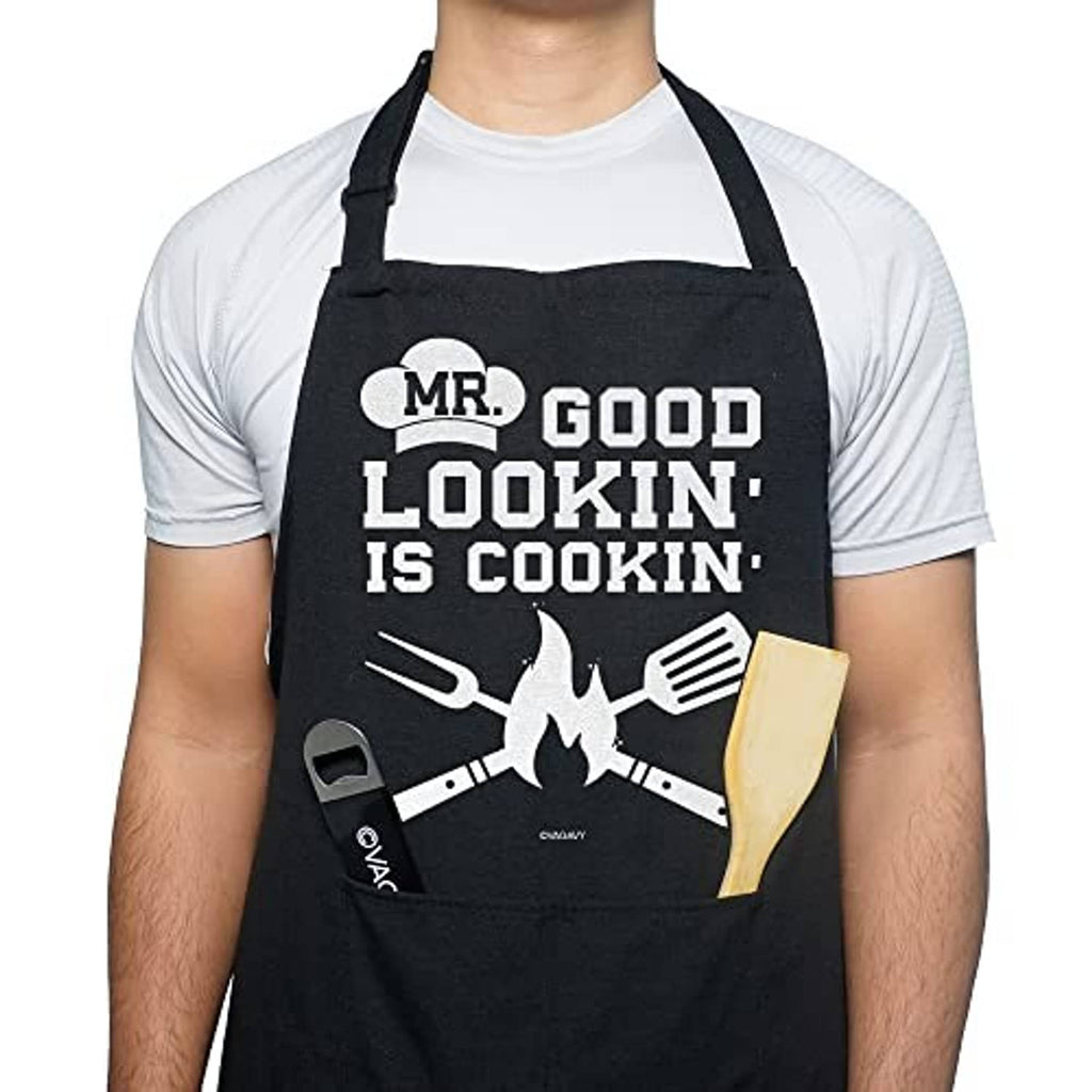 Black cotton apron with centered 'MR. GOOD LOOKIN' IS COOKIN' text and chef graphic