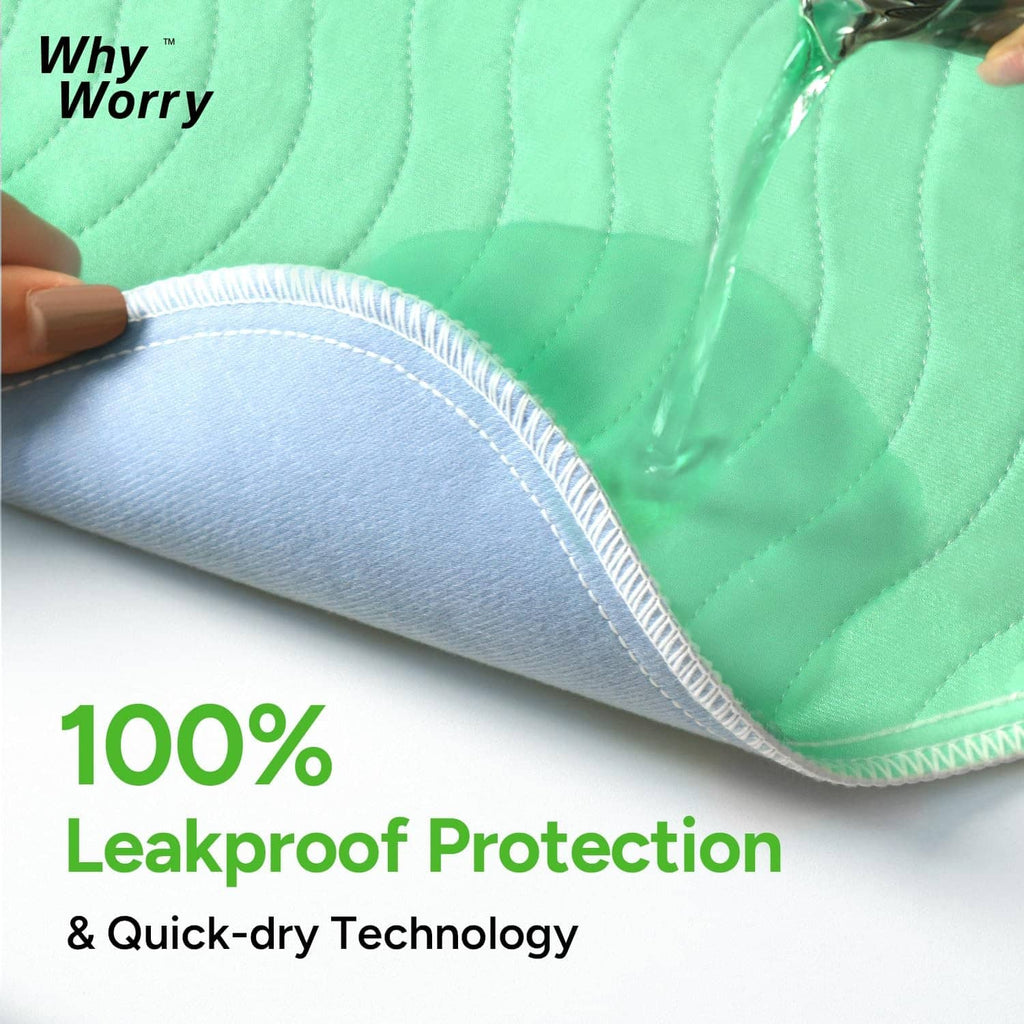 Close-up of green bed pad with stitched edge and padded leakproof surface