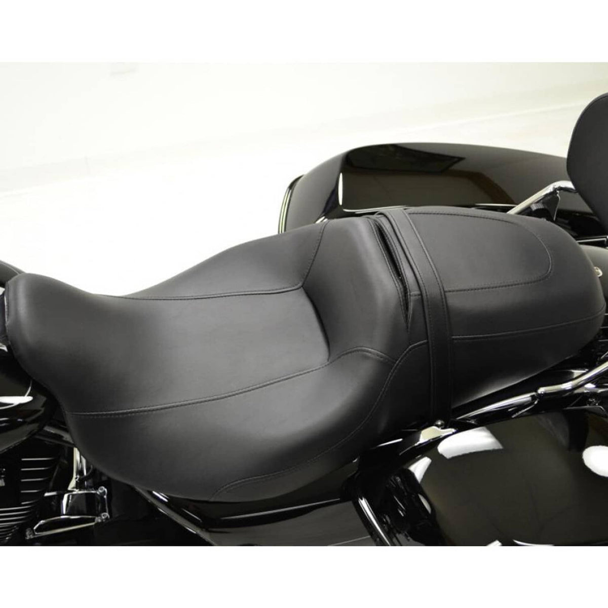 Black contoured motorcycle seat with smooth top, side bolsters, and stitched seams.