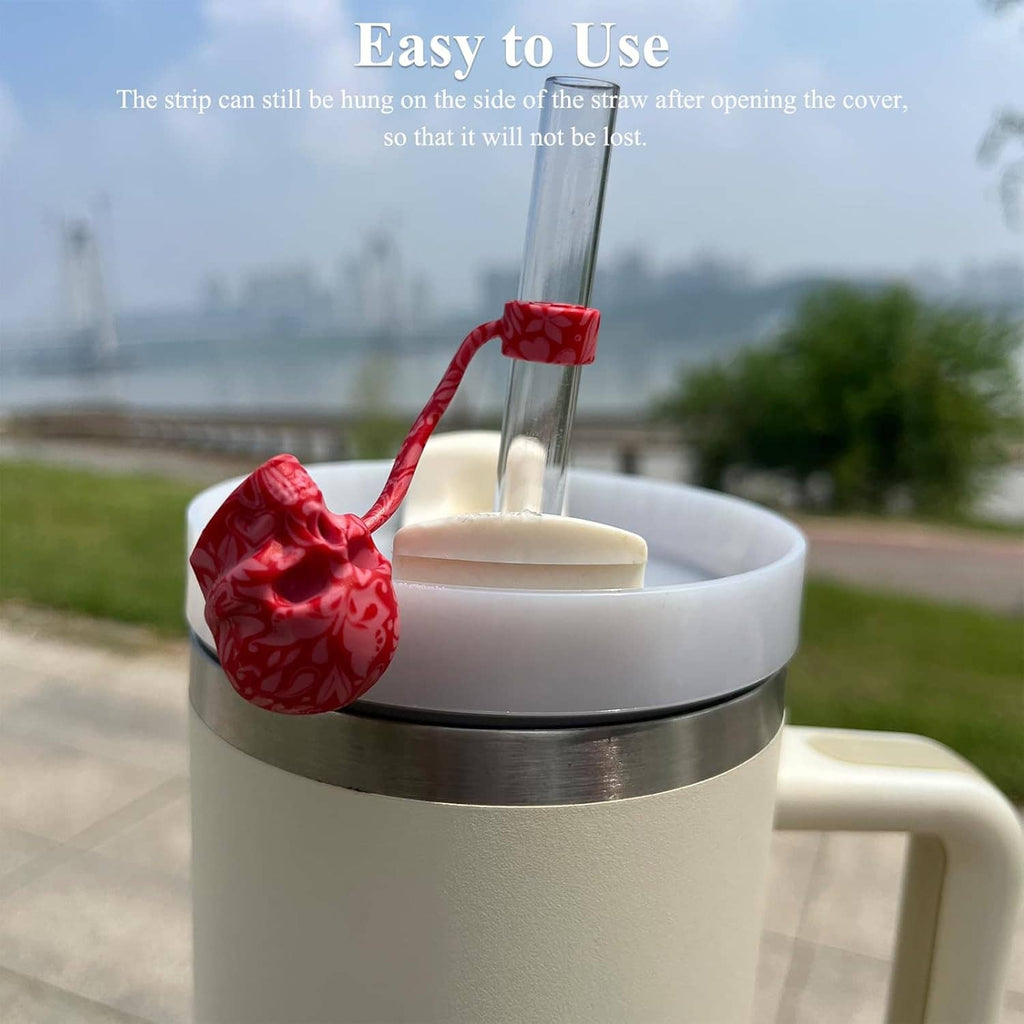 Red 3D silicone sugar skull straw cover cap on a clear straw