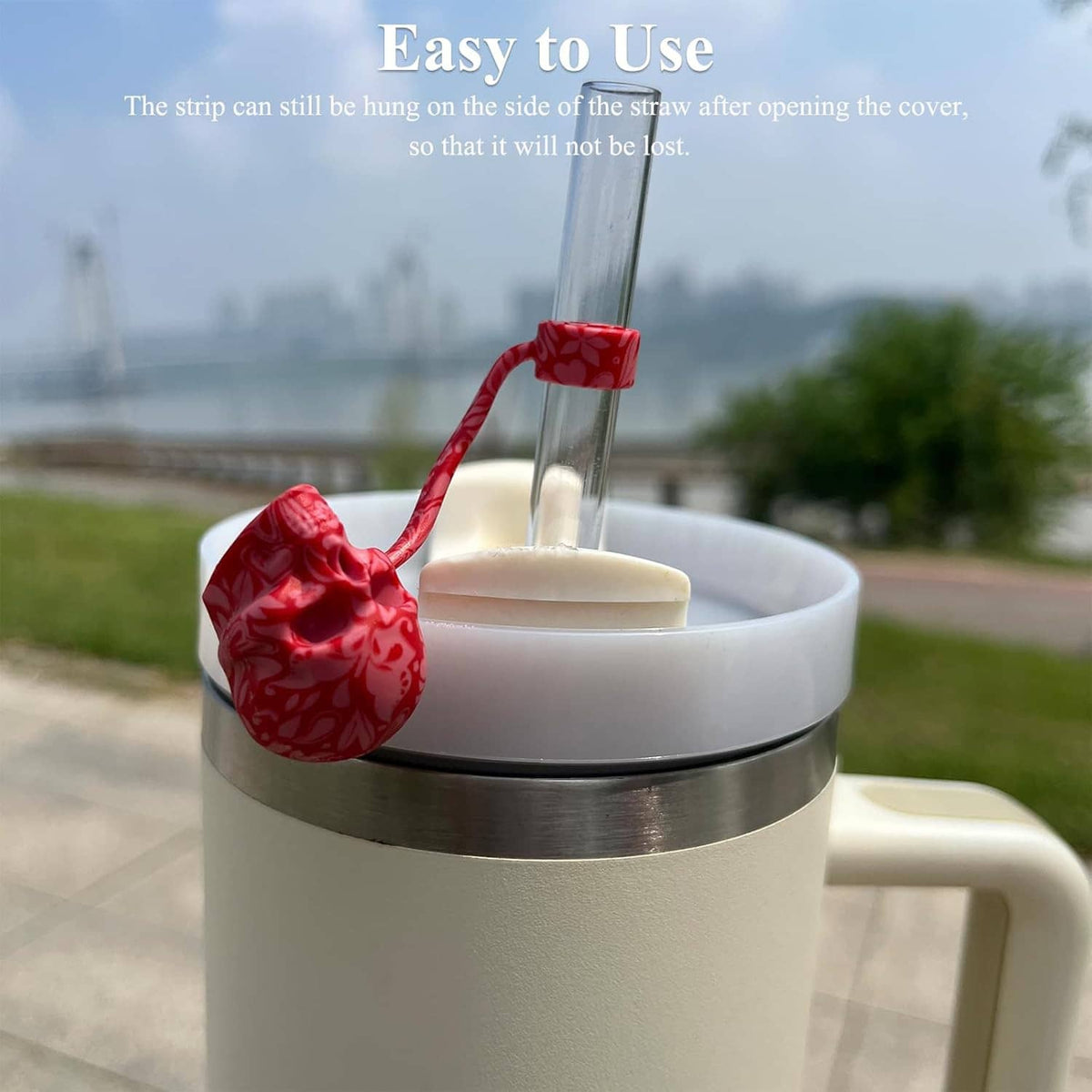 Red 3D silicone sugar skull straw cover cap on a clear straw