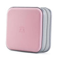 Light pink hard-shell CD case with zipper closure, front view, gray zipper trim