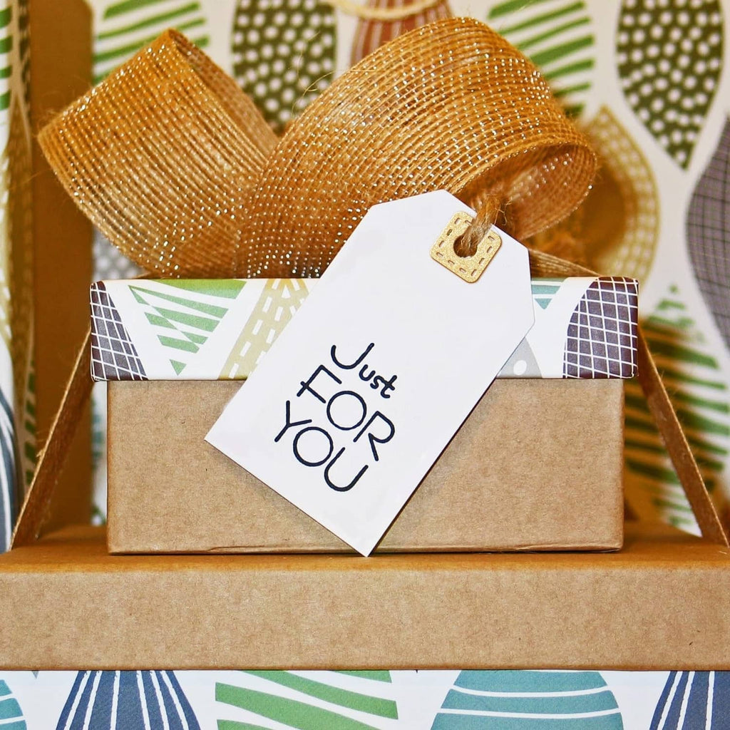 Craft use of reinforced page tab hole die shapes on kraft gift tags with twine