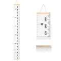 Kids canvas height ruler growth chart with removable wood top, inch and cm markings.