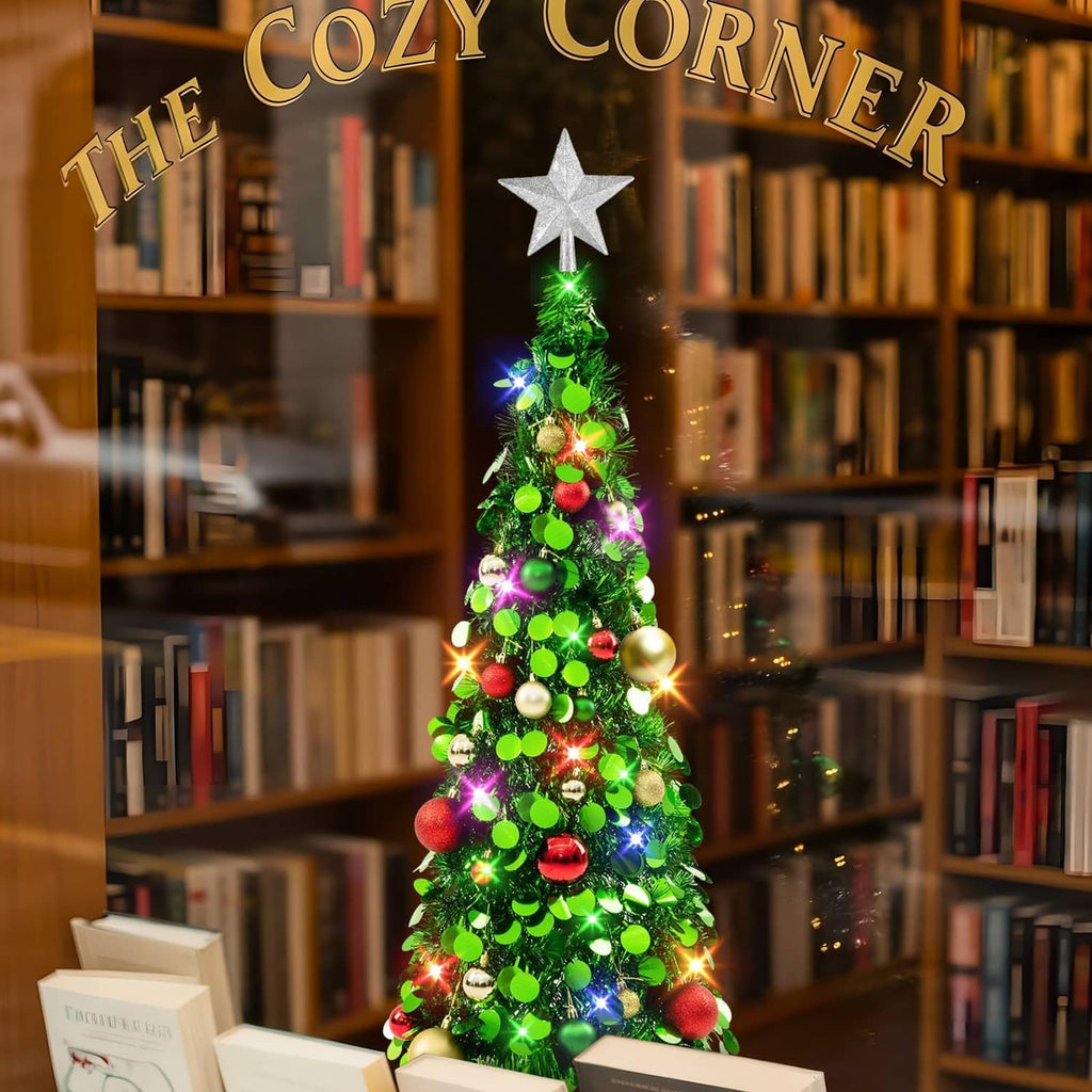 Lit 3ft tinsel Christmas tree with silver star topper, green ornaments, colorful LED lights