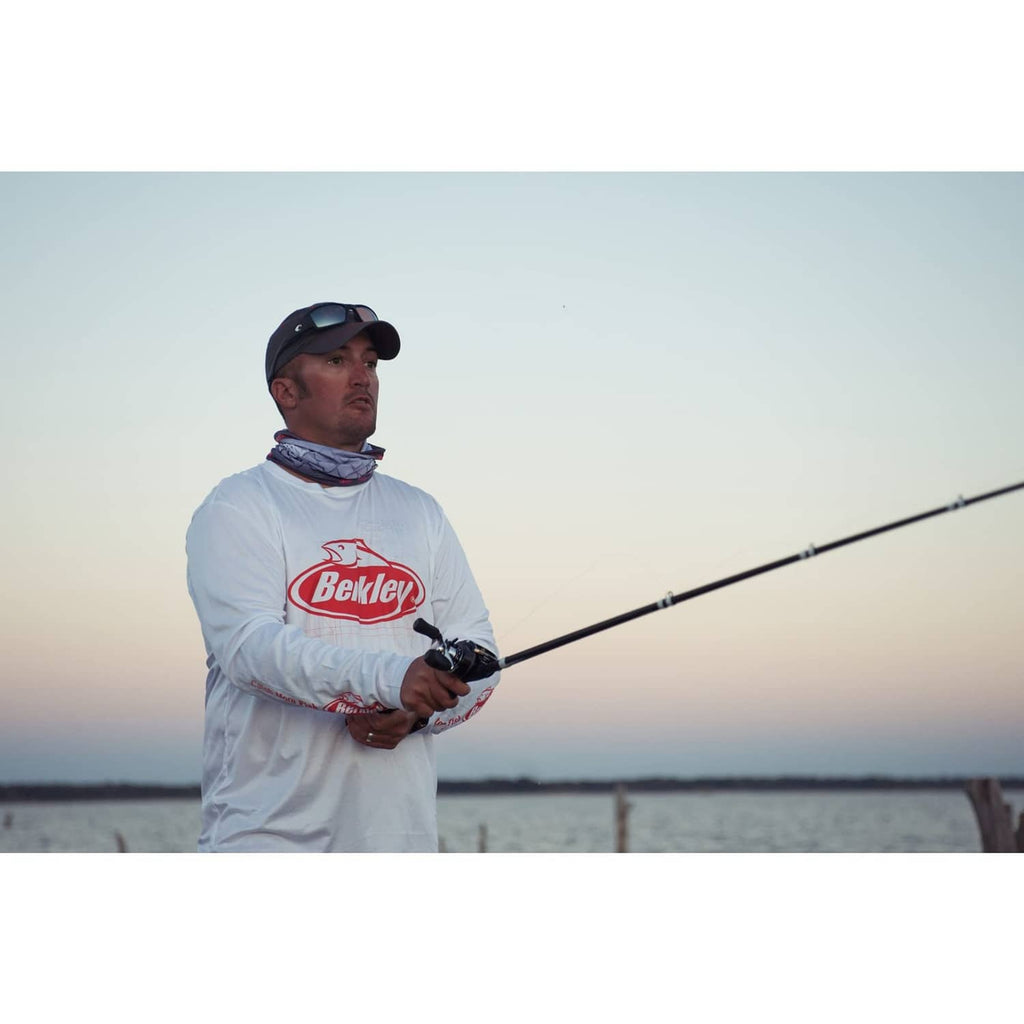 Angler casting a fishing rod from shore