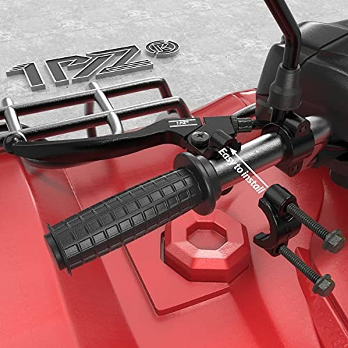 Black clutch and brake lever handles installed on a red ATV handlebar area