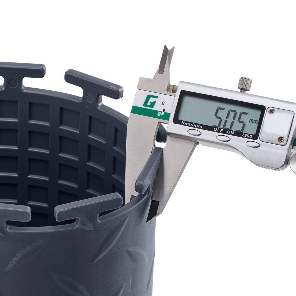 Gray interlocking garage floor tile edge with tabs, measured with caliper