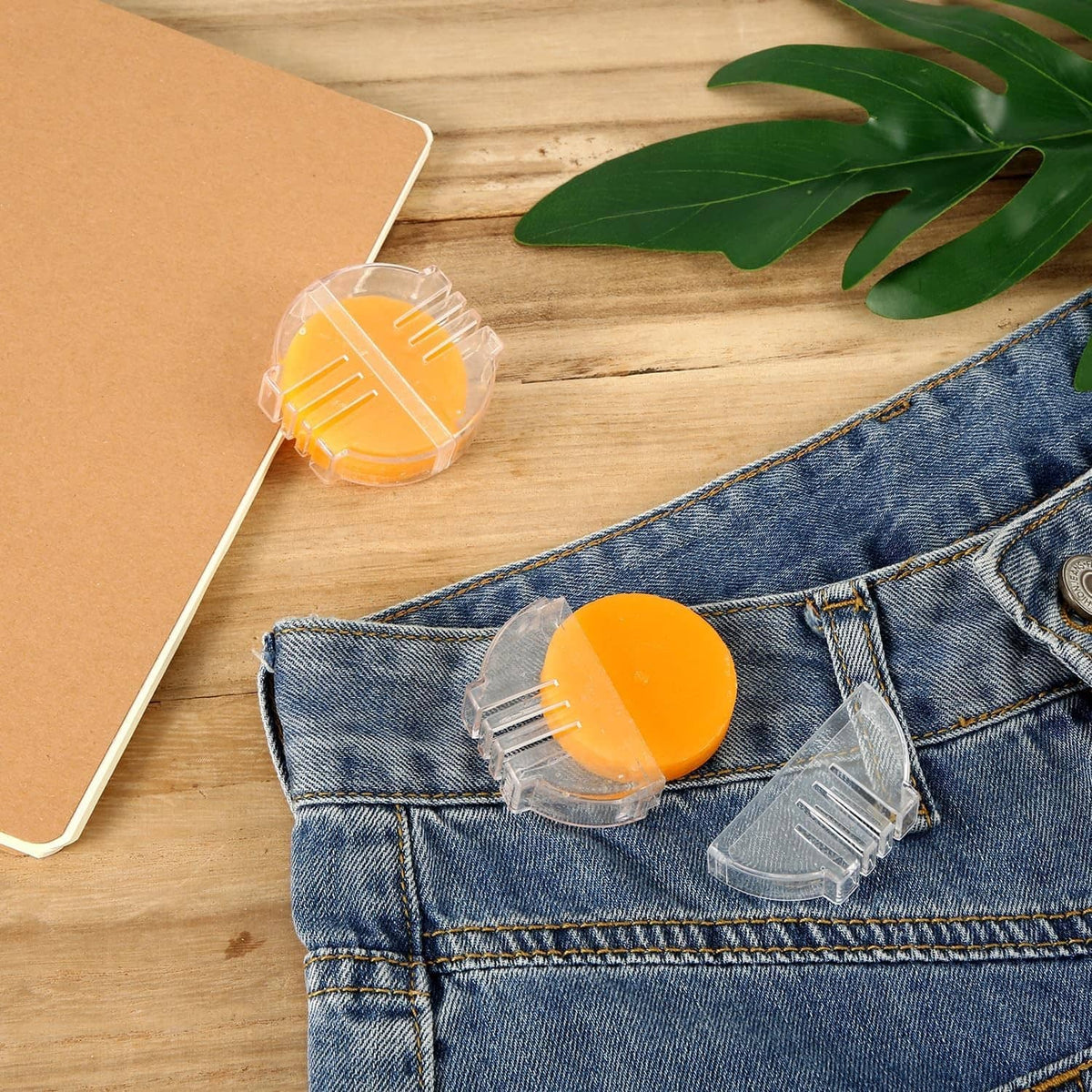 Orange beeswax thread conditioner disc with clear holder for sewing