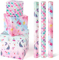 Three mermaid wrapping paper rolls with pink, teal, and white ocean-themed designs