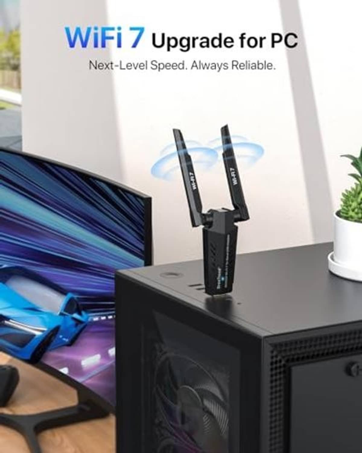 Dual-antenna USB WiFi adapter plugged into desktop PC with antennas upright.