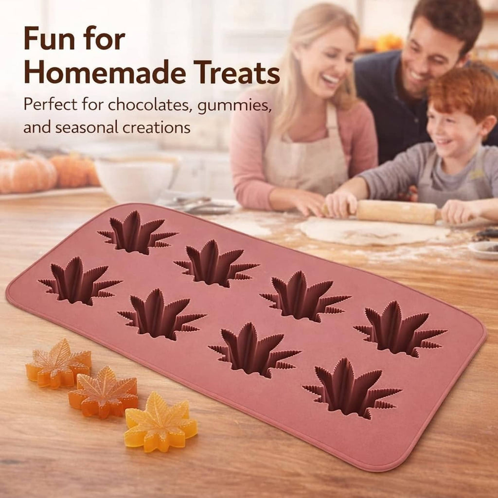 Silicone candy mold tray with raised Japanese maple leaf shapes, pink