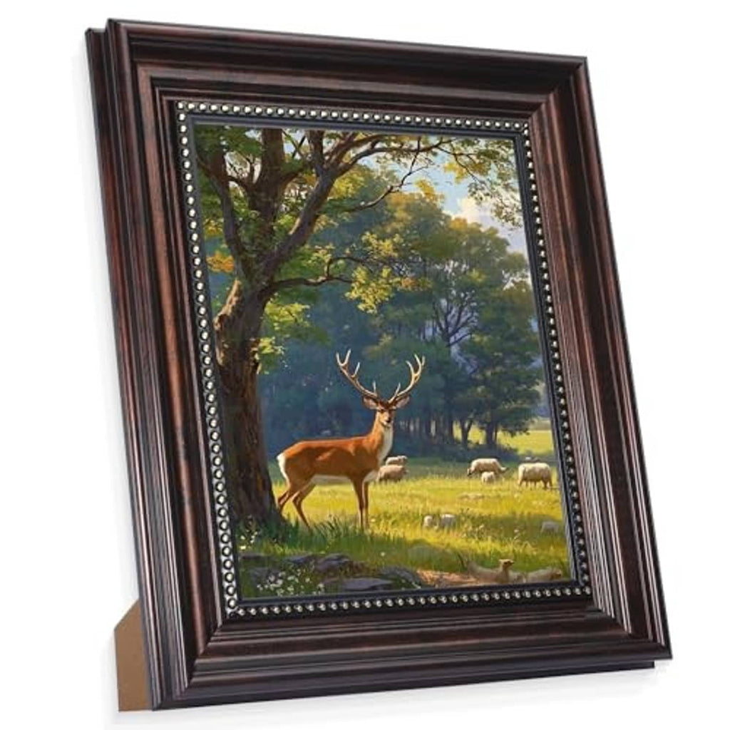 Vintage black picture frame with gold bead trim, displaying an 8x10 deer and landscape photo.