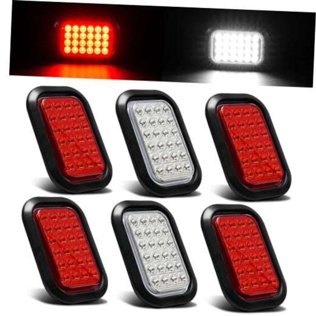 Set of oval LED tail and backup lights with red and white lenses in black housings