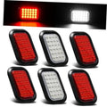 Set of oval LED tail and backup lights with red and white lenses in black housings