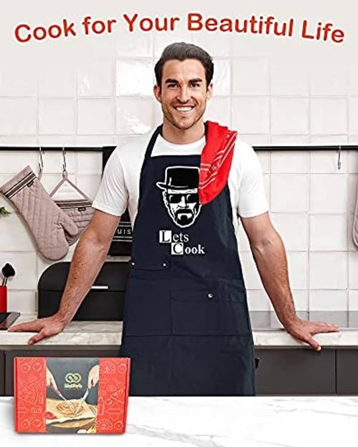 Black chef apron with "Let's Cook" print and two front pockets