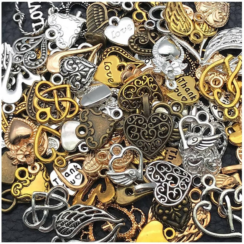 Assorted heart and pendant charms in gold, silver, and dark tones with small rings