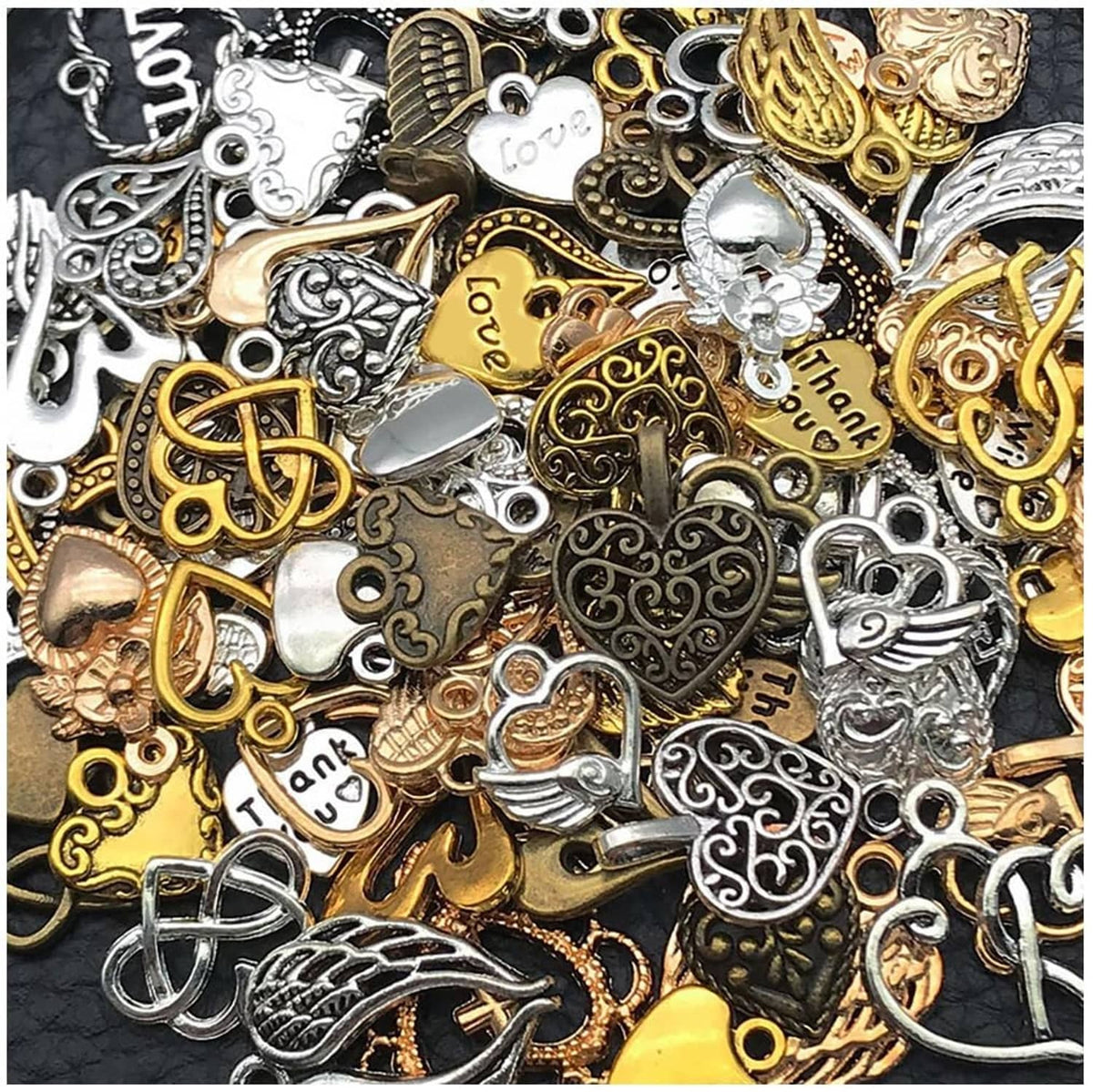 Assorted heart and pendant charms in gold, silver, and dark tones with small rings