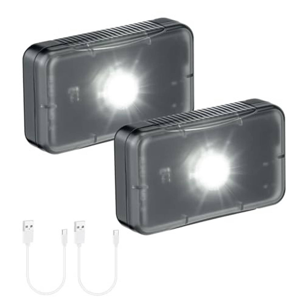 Two dark rectangular LED sensor lights with bright LEDs and charging cables