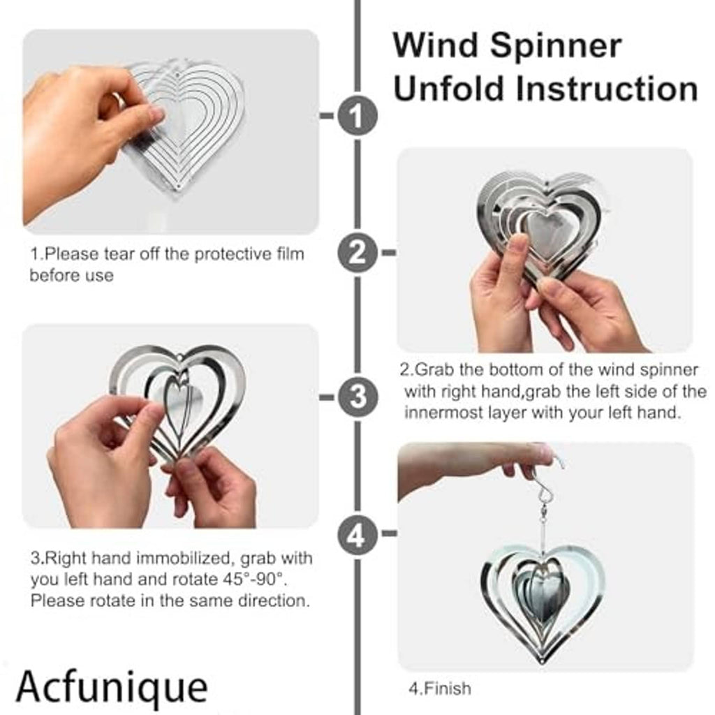 Hand installation of heart-shaped stainless wind spinner with hanging hook and protective film.