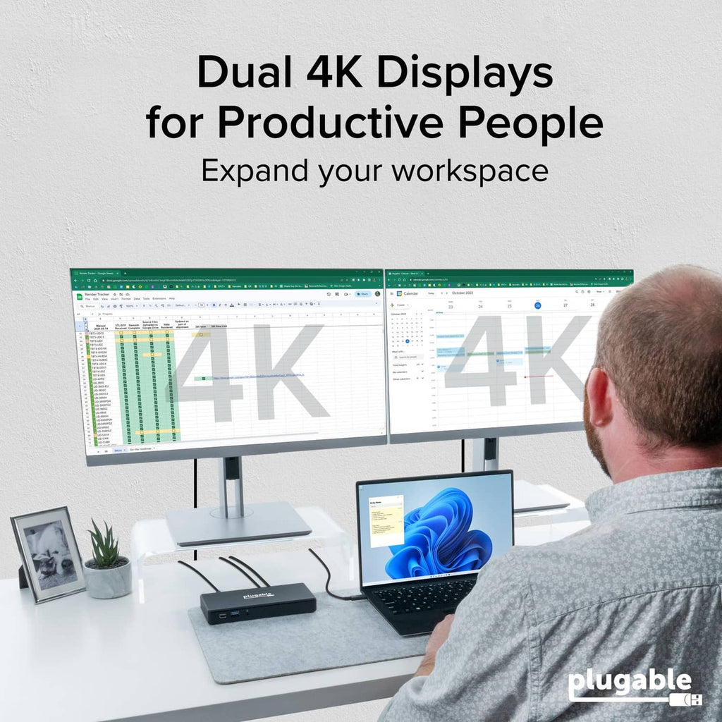 Black USB-C docking station on desk powering dual displays for laptop work