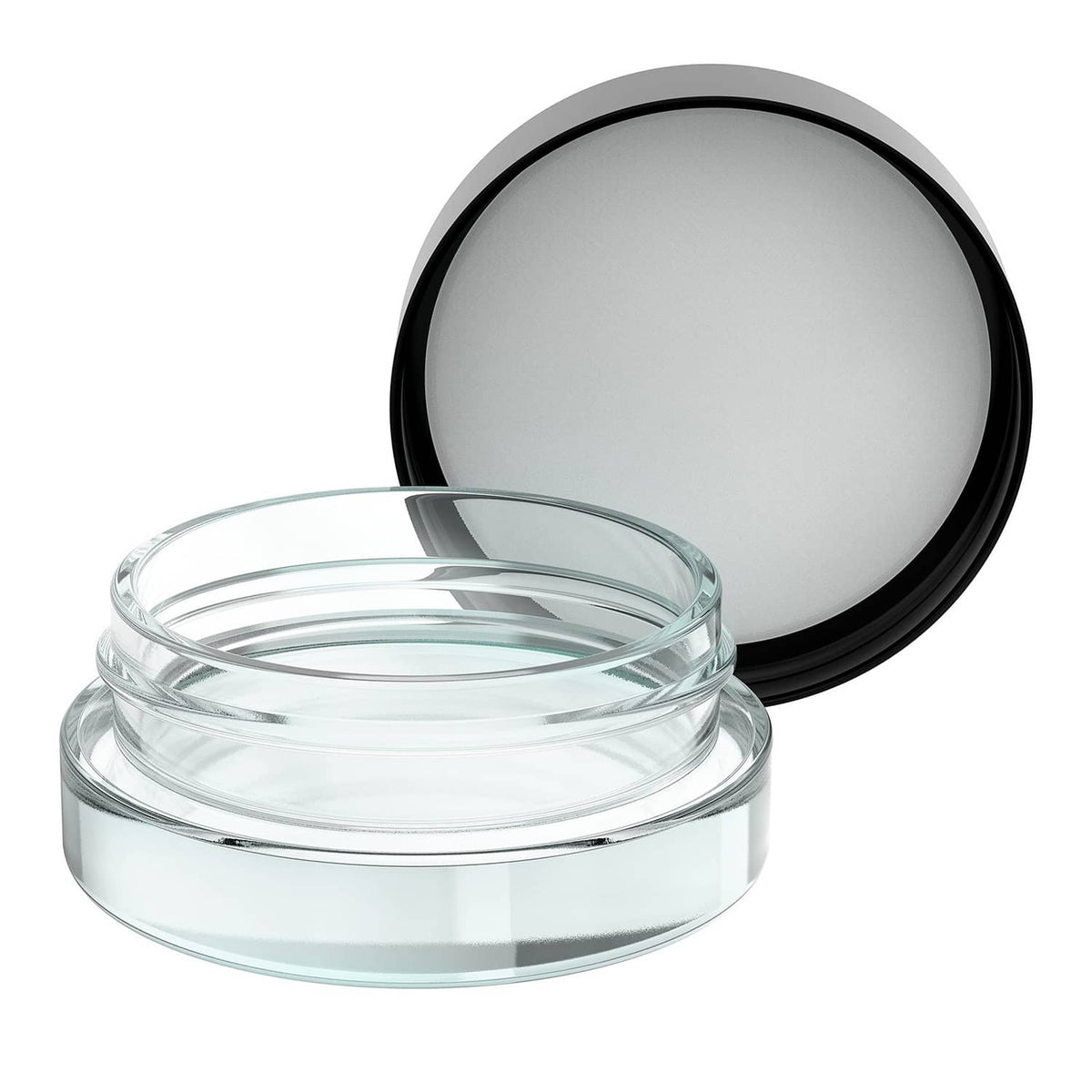 Clear glass jar with black lid, lid placed behind jar