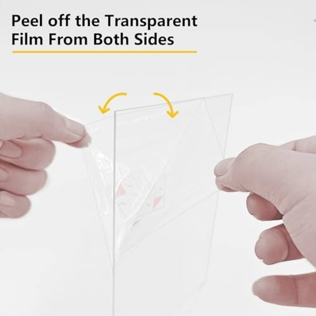 Hands peeling transparent protective film from a clear acrylic sheet for the frame
