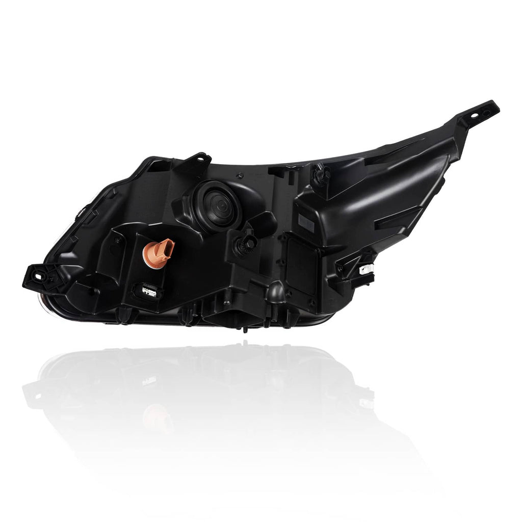 Black headlight housing with projector lens opening and orange marker detail, rear view