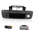 Rear tailgate backup camera with black textured housing and lens, mounting bracket included