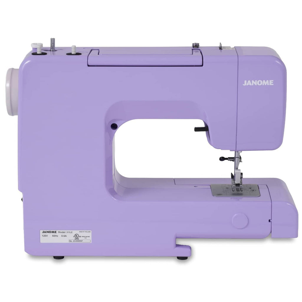 Purple Janome sewing machine side view with handwheel and rear label