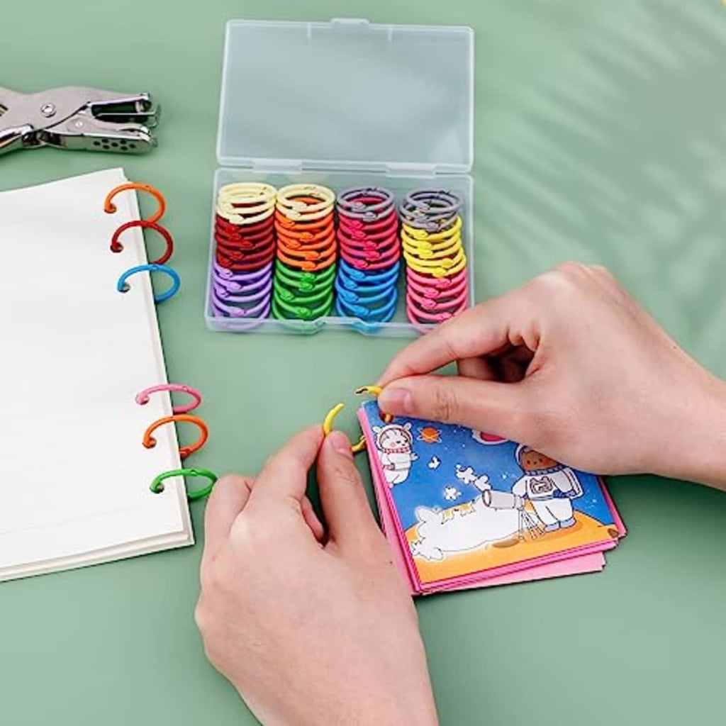 Colorful binder rings in a small plastic storage box, ready to use