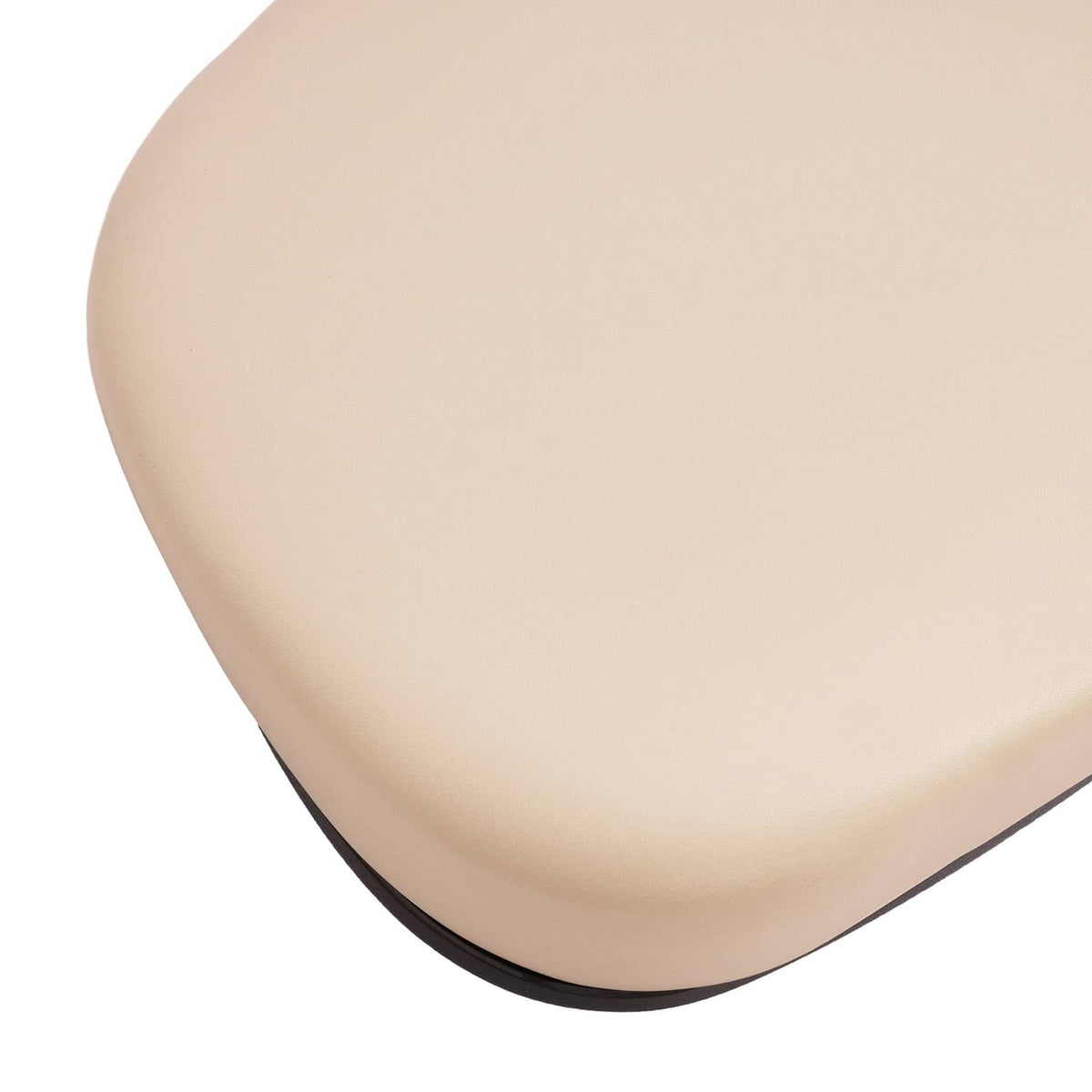 Beige seat back cushion end with smooth curved surface and black underside edge