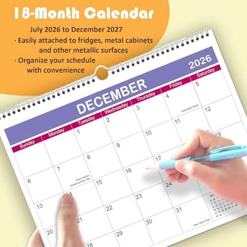 Spiral wall calendar page for December 2026 with deep blue header and hand marking dates.