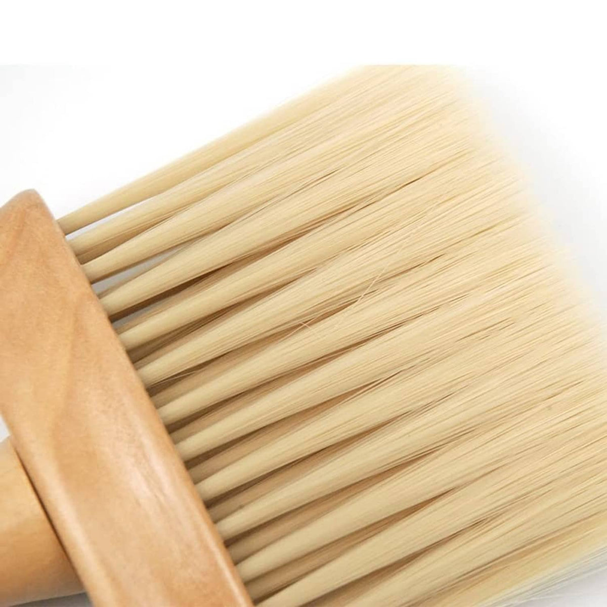 Wooden hair cutting brush with pale bristle tips and curved handle