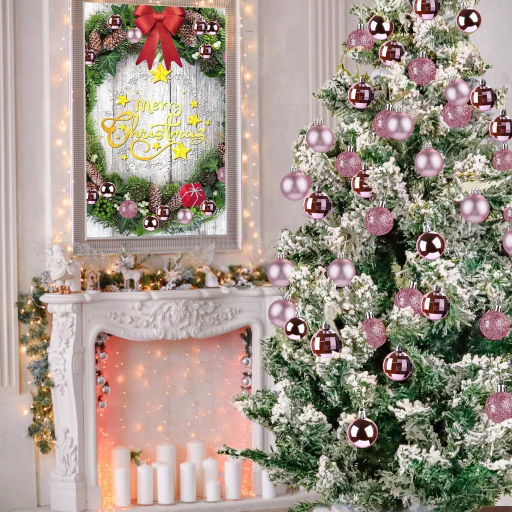 Christmas tree decorated with pink bauble ornaments, some glitter and some smooth