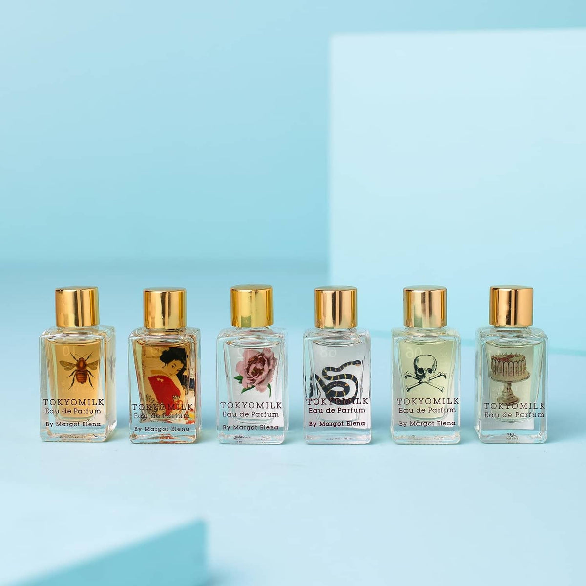 Set of six mini eau de parfum bottles with gold caps, TOKYOMILK fragrance lineup